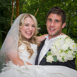 Wedding Couple Groom carring Bride